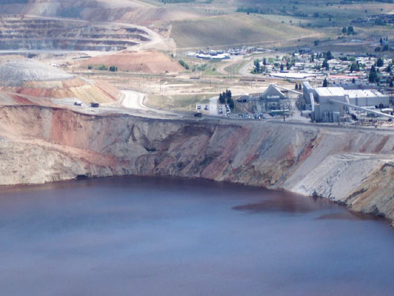 This photo from July 2013 shows the rim of the Berkeley Pit were a slough deposited surface material into the Pit lake in Feb. 2013. Photo by Fritz Daily.